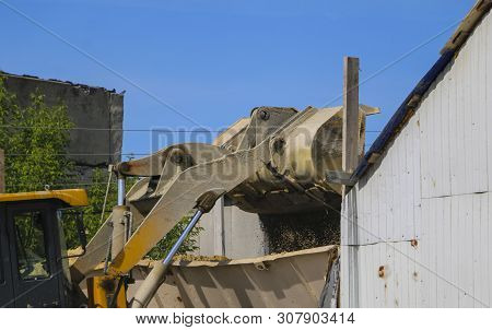 Tractor Collects Scoop With  Gravel. Excavator Extracts Sand And Gravel For  Concrete Mix.