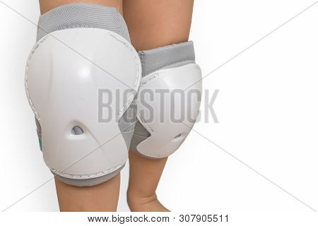 Pair Of Knee Pads Wearing On Legs Of Child