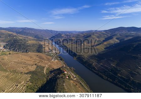 Scenic Aerial View Of The Douro Valley And River With Terraced Vineyards Near The Village Of Tua, Po