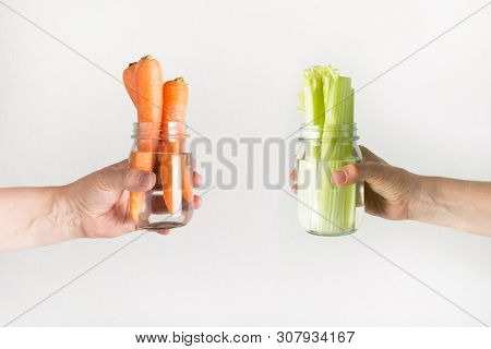 Fresh Carrot And Celery In Mason Jar With Water. Save Summer Harvest. Storage. Zero Waste.