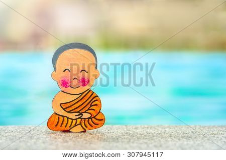 Buddhist Boy On Vacation Sitting In Lotus Position Happy Summer At The Edge Of The Pool. Close Up, C