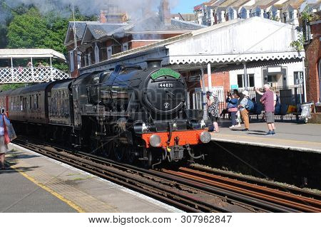 ST. LEONARDS-ON-SEA, ENGLAND - JUNE 22, 2019: London Midland and Scottish Railway Class 5 steam locomotive, 44871, hauls an excursion train. Designed by William Stanier, it was built in 1945.