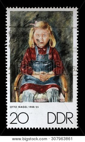 ZAGREB, CROATIA - JULY 03, 2014: A stamp issued in Germany - Democratic Republic (DDR) shows Portrait of a girl by Otto Nagel, circa 1970