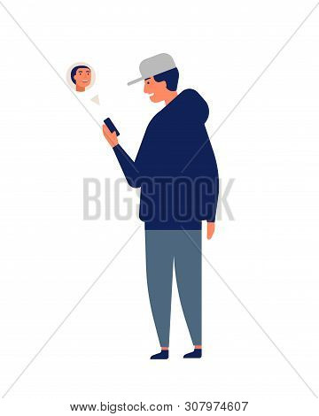 Young Man Or Teenager Wearing Cap Chatting Online Or Texting On Smartphone Or Mobile Phone. Guy With