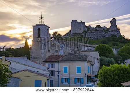 View On Traditional Medieval Houses And Castle Ruines In Provence During Sunrise, South Of France, V
