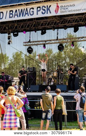 Music Scene On Danube Island. People Gathering To Listen To The Music Band In Vienna Austria