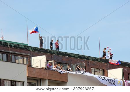 Prague, Czech Republic - June 23 2019: People On A Roof Of A Building Supporting Protests Against Pr