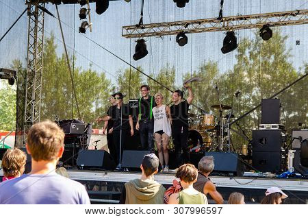 Music Scene On Danube Island. People Gathering To Listen To The Music Band In Vienna Austria