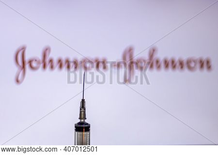 Kathmandu, Nepal - February 7 2021: Syringe Injection Placed Against Johnson And Johnson Logo. Jnj C