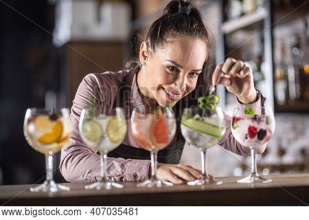 Broad Selection Of Gin Tonic Drinks Made On A Bar By A Good-looking Barmaid.