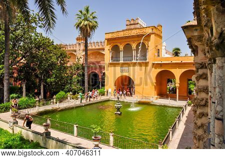 Pond With Fountan In Seville Alcazar Gardens, Andalusia, Spain - June 2018