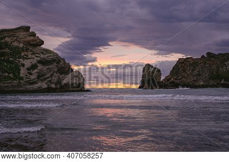 Colorful Dusk At The Cliffs On The Ocean. Castle Point, New Zealand.