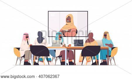 Team Of Arabic Doctors Having Video Conference With Female Black Muslim Doctor Arab Medical Professi