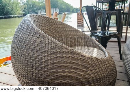 Close Up Rottan Chair At Riverside Restaurant For Seat