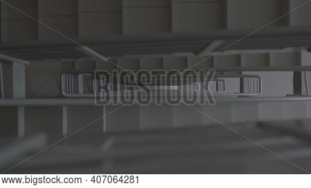 Stairs In A High Rise Building And A Man Going Down. Stock. Top View Of Man Descending The Concrete 