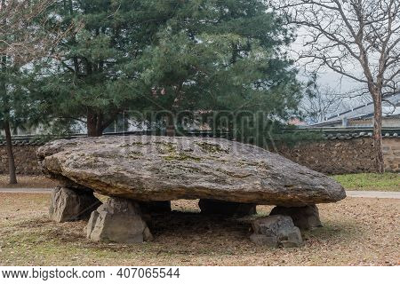 Dolmen Burial Chamber With Large Boulder Used As Capstone On Top Of Smaller Stones In Neolithic Park