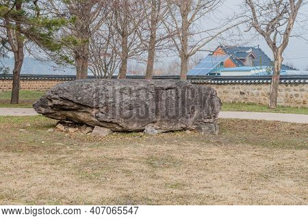 Dolmen Burial Chamber With Large Boulder Used As Capstone On Top Of Smaller Stones In Neolithic Park