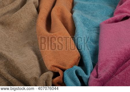 A Closeup Of Wrinkled Natural Colorful Chenille Fabric Texture