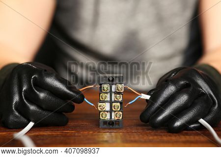 Electrician Hands Connecting Wires In Terminal Block. Connection Of Wires With Clamps. An Electricia