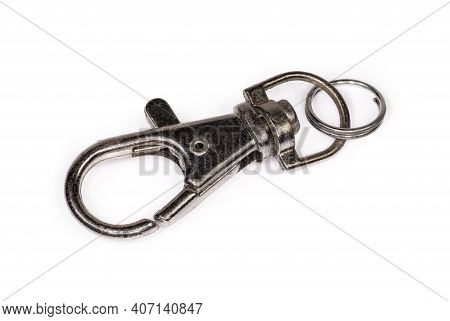 Small Metal Swivel Eye Snap Hook With Attached Steel Split Ring On A White Background Close-up