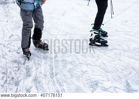 A Skating Ice Rink With Skating Children.