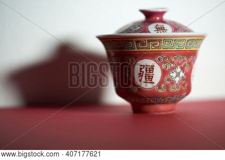 Chinese antique pink tea bowl with chinesecharacter , cover and saucer. word translated attain boundless longevity           