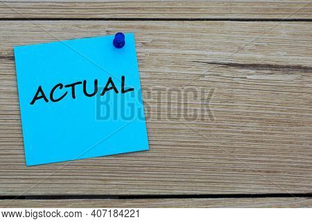 Actual Is An Word Written On A Blue Sheet Attached To A Wooden Board. Busines Concept. Keep It Simpl