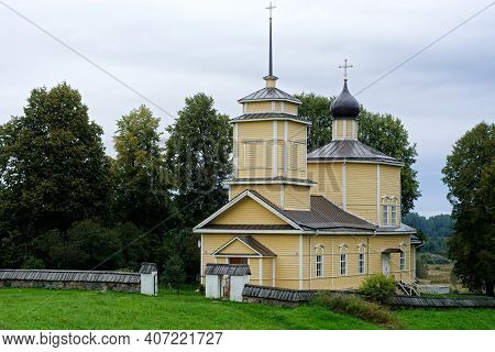Church Of St. George The Victorious In Voronich Against The Backdrop Of A Cloudy Cloudy Sky With Tre