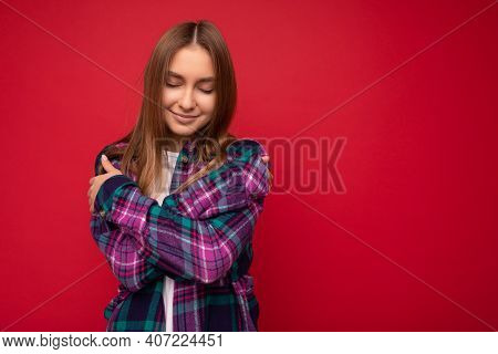 Photo Of Beautiful Cute Pretty Young Blonde Woman Wearing Stylish Purple Shirt Isolated Over Red Bac