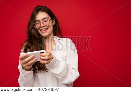 Photo Of Pretty Smiling Positive Young Brunette Woman Wearing White Shirt And Optical Glasses Isolat