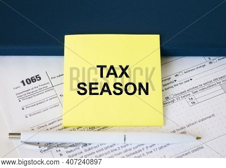 Tax Form 1065 With Yellow Sticker With Text Tax Season. Notepad And White Pen
