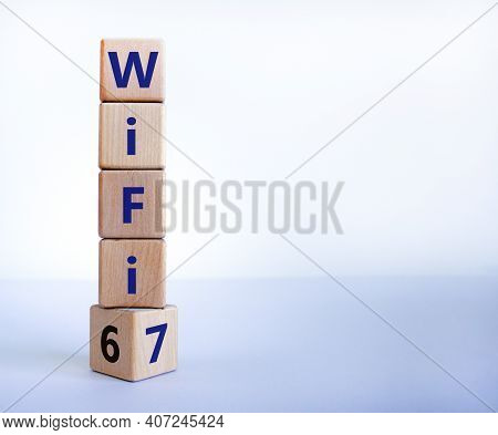 Wifi 6 Or 7 Symbol. Turned A Wooden Cube And Changed The Words Wifi 6 To Wifi 7. Beautiful White Bac