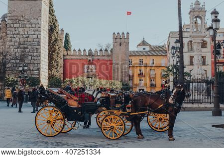 Seville, Spain - January 19,2020: Horse Carriage Waiting For Tourists On Plaza Del Triunfo, Small Pl