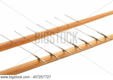 Silver Needles For Traditional Chinese Medicine Acupuncture. Close-up. Isolated On White Background.