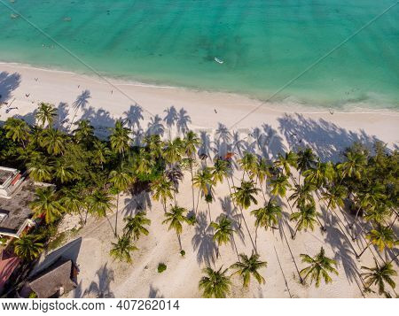 Aerial Top View On Paje Beach With Palm Trees Shadows At Evening Time. Paje Village, Zanzibar, Tanza