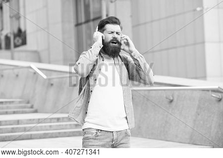 Cause The Streets Are Singing. Happy Hipster Sing Song Urban Outdoors. Bearded Man Enjoy Singing In 