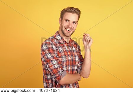 Handsome Man Model Portrait. Charismatic Man Wearing Checkered Shirt. Guy In Plaid Shirt Standing Wi