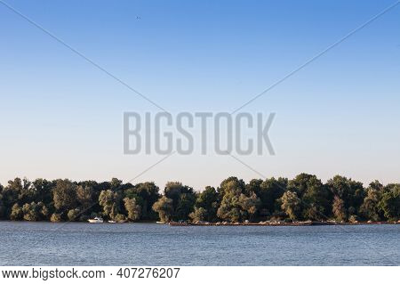 Cargo Ship, A Barge, Cruising On The Danube River In Serbia, In Belgrade, Carrying Construction Mate