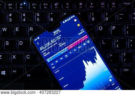 Kathmandu, Nepal - February 8 2021: Stock Value Of Bitcoin On A Smartphone Against Laptop Keyboard. 