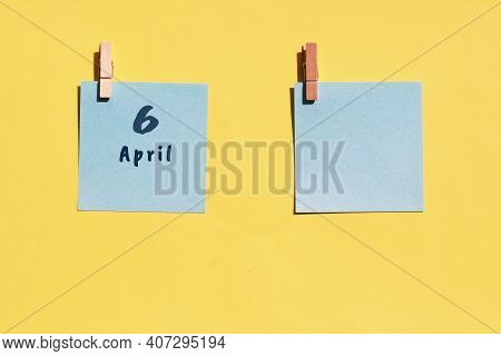 April 6st. Day Of 6 Month, Calendar Date. Two Blue Sheets For Writing On A Yellow Background. Top Vi