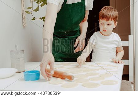 Little Boy Helps Mother To Cook  Making Homemade Coockies. Casual Lifestyle In Home Interior, Pretty