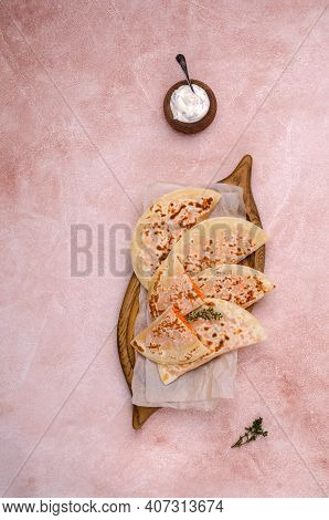Baked Bread With Vegetable Filling On A Stone Background. Selective Focus.