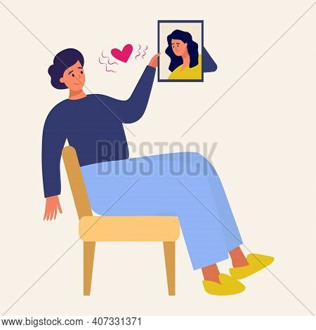 A Man Looks At A Picture Of His Beloved. A Man In Love, Love At A Distance, Framed Portrait Of His B