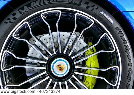 LONDON, UK - CIRCA JUNE 2014: Closeup of a Porche 918 Spyder wheel, carbon ceramic brake system and Michelin tire.