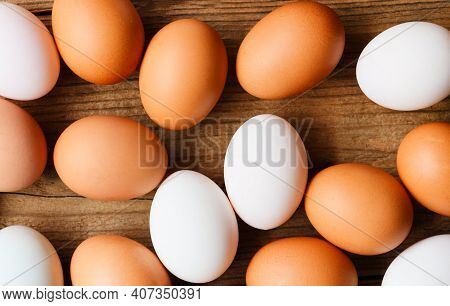 Fresh Chicken Eggs And Duck Eggs On Wooden Background Top View, Collect From Farm Products Natural I
