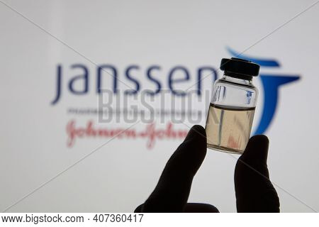 Oxford, Uk - February 2020: A Covid Vaccine Vial Against The Janssen Logo
