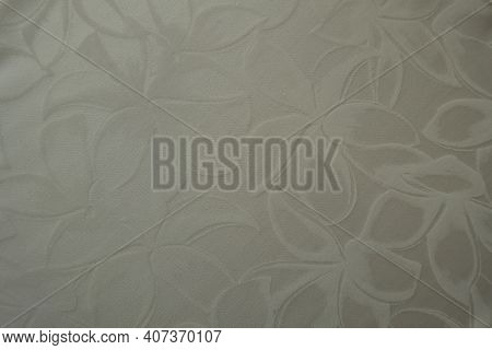Close Shot Of Glossy Cream Colored Polyamide Fabric With Floral Pattern