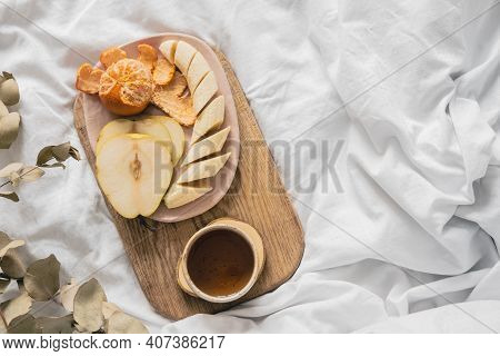 Tray With Fruits And Cup Of Tea In White Clean Bed. Mindful And Quiet Living, Slow Life, Bed In Brea