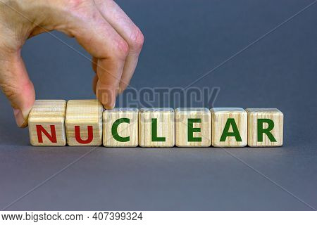 Nuclear Or Clear Symbol. Businessman Turns A Cube And Changes The Word 'nuclear' To 'clear'. Beautif