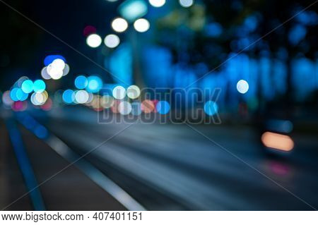Blurred Night City Street. City Night Lights. Blue Tones